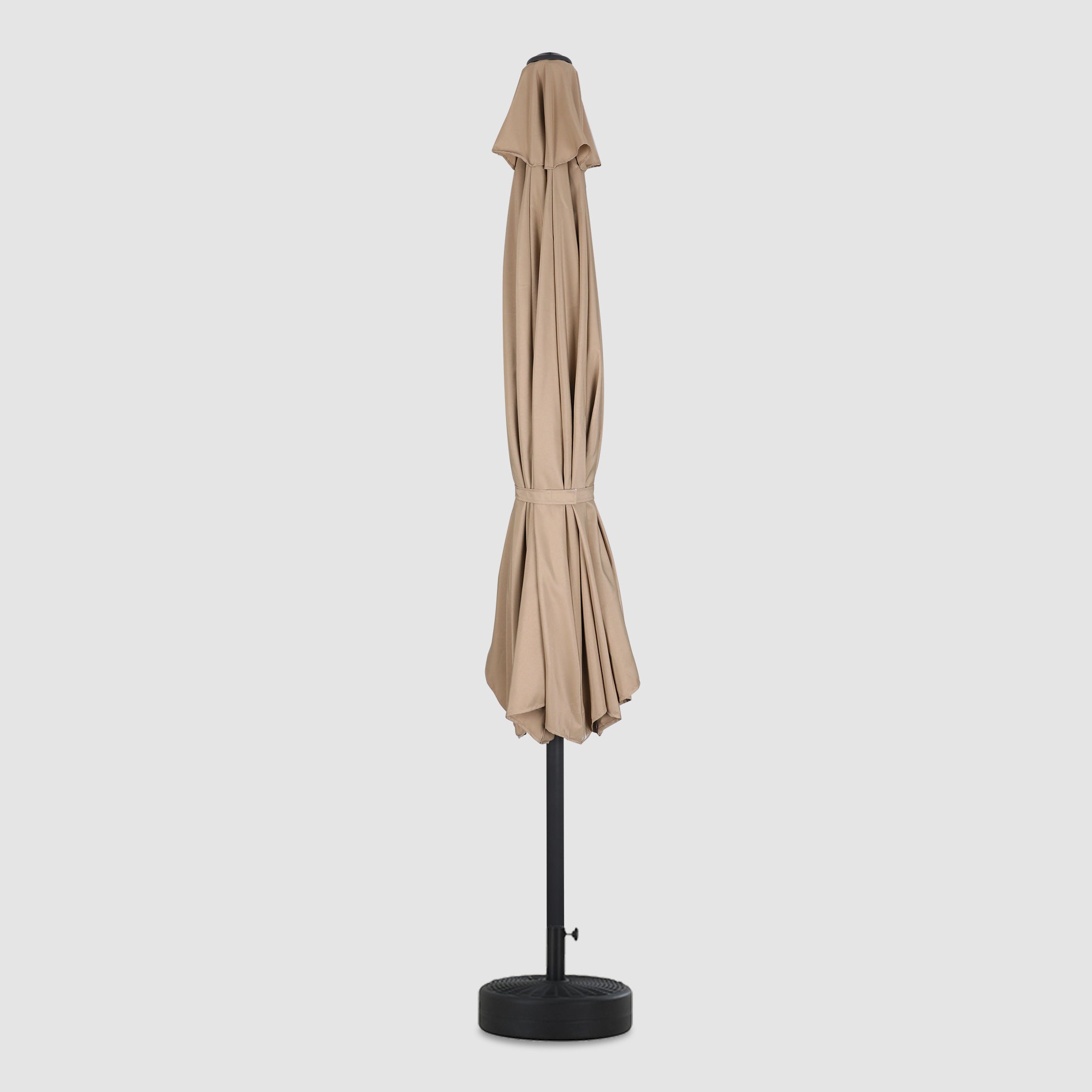 Front view, closed and long, high quality, durable khaki patio umbrella with a windproof hood.