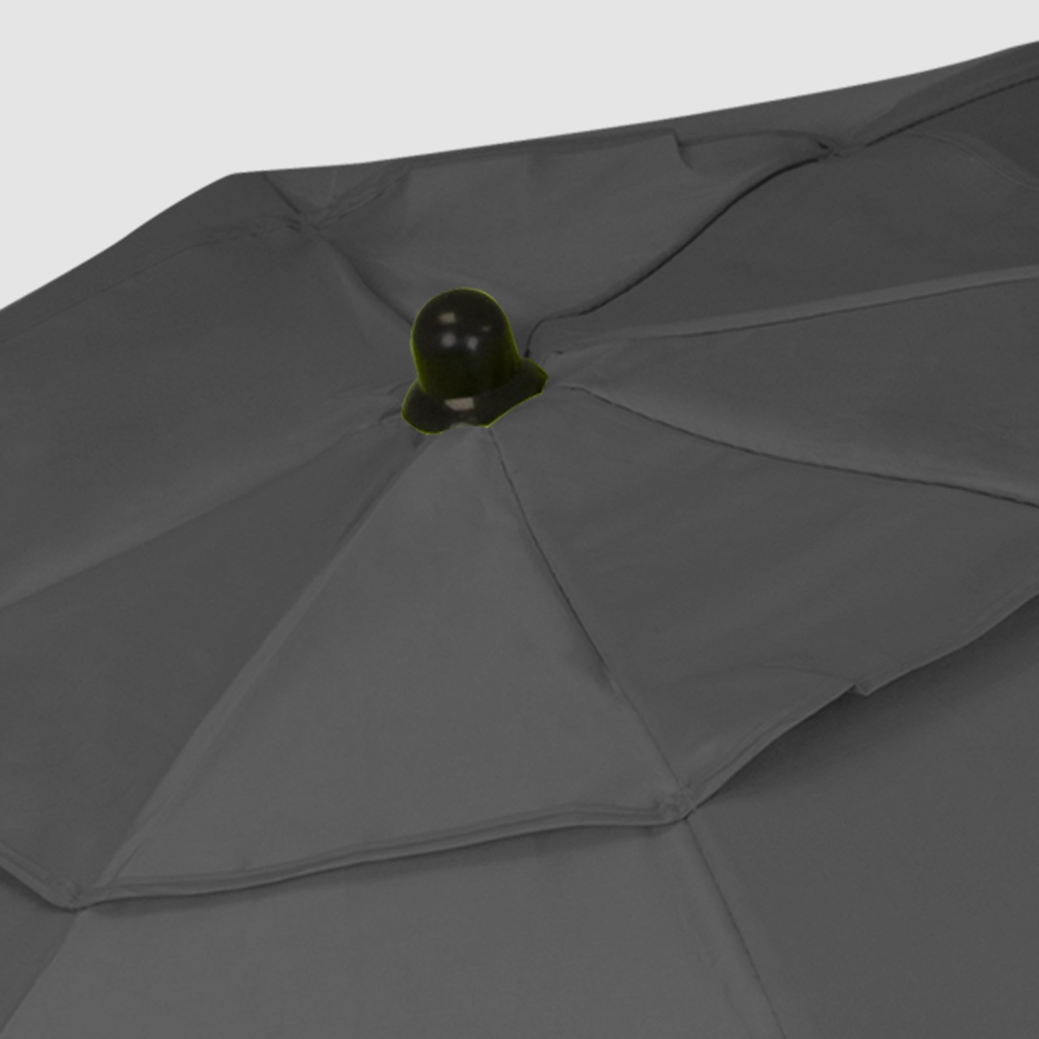 High-quality, robust Black foldable beach umbrella with black cap on top.