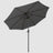 The open Dark Grey best patio umbrella with a windproof hood is seen from below, the inner skeleton of the umbrella can be seen as well as the black pole. 