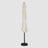 The long, folded Beige patio umbrella, as seen from the front, is of high quality and durability with a windproof hood. 